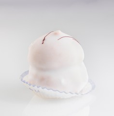 delicious little white cream cake with chocolate decoration