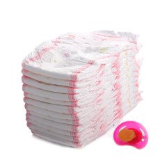 stack of diapers with babys dummy