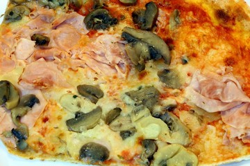 pizza with tomato ham mushrooms