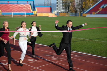 business people running on racing track