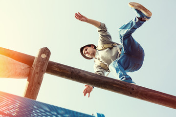 traveler walking balance over top of wooden construction