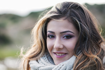 Fototapeta premium Beautiful young woman on the sunset beach, outdoor image