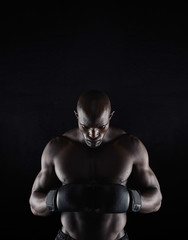 Fototapeta na wymiar African boxer preparing for fight