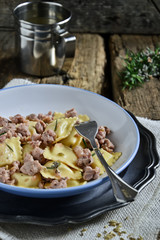 Stuffed pasta. Ravioli to sausage sauce.