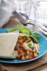 Pita bread with couscous and chickpeas