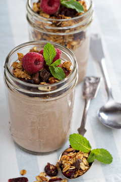 Chocolate smoothie with granola for breakfast