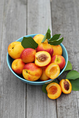 Fresh peaches in blue bowl