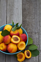 Fresh peaches in blue bowl
