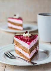piece of cake with sponge cake, cream berry mousse and jelly