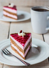 piece of cake with sponge cake, cream berry mousse and jelly