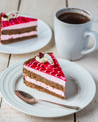 piece of cake with sponge cake, cream berry mousse and jelly