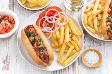 fast food - hot dog with French fries and chips, top view