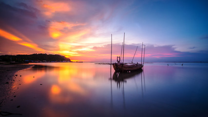Broken ship with the sunset