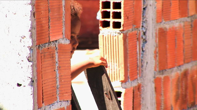 Girl home hillside favela poor housing Rio de Janeiro Brazil South America