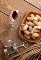 Fototapeta na wymiar Red wine, corks and corkscrew