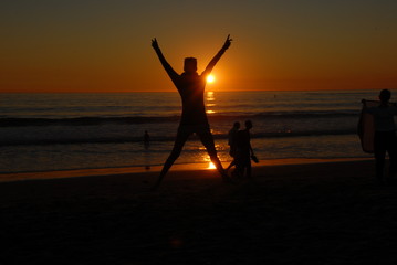 Fototapeta premium jumping girl at sunset