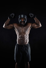 Muscular boxer celebrating his success