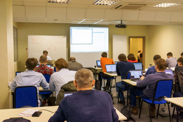 people sitting rear at the computer training class