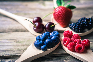 Berries on wooden rustic background