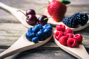 Berries on wooden rustic background