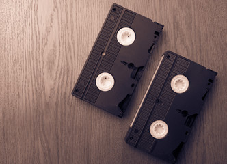 old retro video tape over wooden background