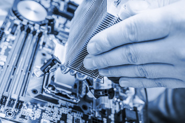 Hand installing the computer chip