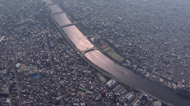 Aerial Sumida River bridges Tokyo city shipping barge Japan 