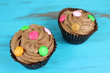 chocolate cupcakes on a turquoise wood background