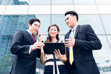 Asian businesspeople working outside