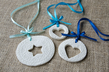 White ornaments with blue ribbon