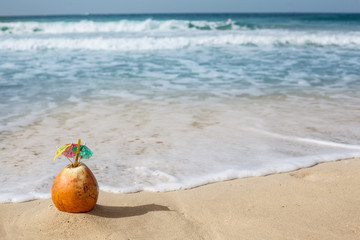 Coconut in the sand.