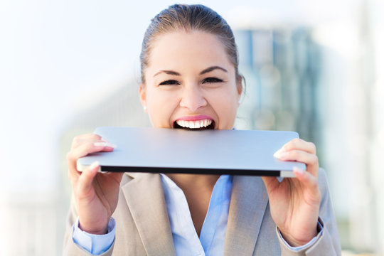 Woman Biting A Laptop