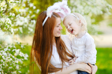 Mother and daughter wearing bunny ears on Easter