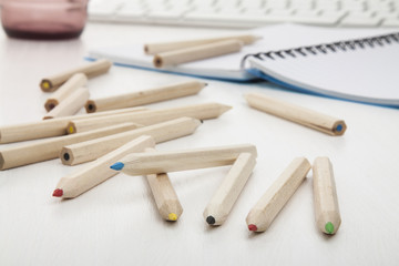 Fototapeta na wymiar colored pencils on white wooden desk.