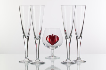 Different glasses and red heart