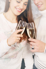 holding champagne glasses
