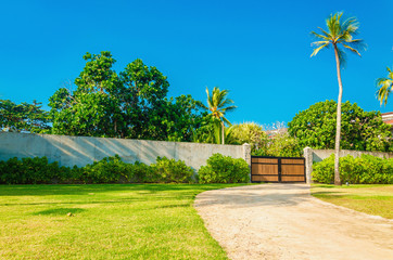 Wooden entrance of a uxury properties in exotic scenery