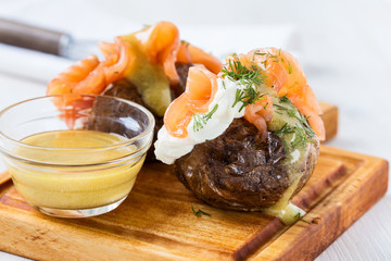 Jacket potatoes with  soft cheese and smoked salmon
