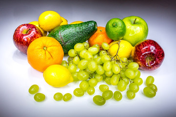 Real colorful fruits painted with light