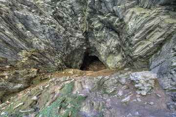 The entrance to the cave in mount Akhun , Sochi