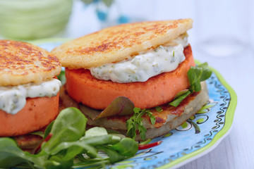 Salmon burger with potato pancakes