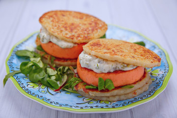Salmon burger with potato pancakes