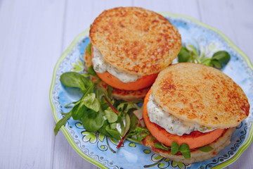 Salmon burger with potato pancakes