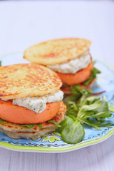 Salmon burger with potato pancakes
