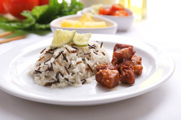 Tasty rice with meat served on table, close-up
