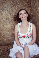 Fototapeta premium Attractive girl in the hay