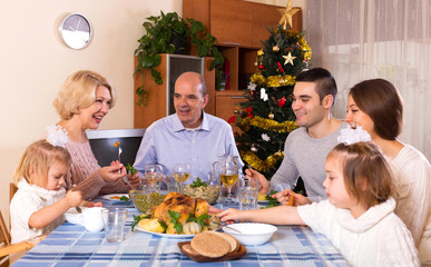 happy parents with adult kids and grandchildren