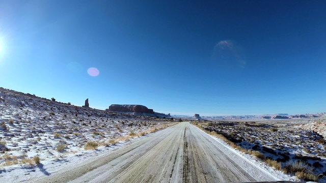 POV Monument Valley driving winter snow extreme terrain sandstone Utah USA