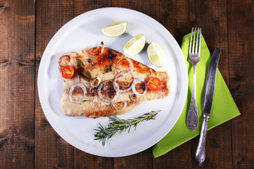 Dish of Pangasius fillet with spices and vegetables