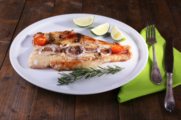Dish of Pangasius fillet with spices and vegetables